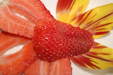 Image showing macro of strawberry slices and petals