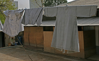 Image showing Monks robes hanging on clothes line