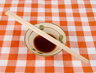 Image showing Soy sauce and chopsticks