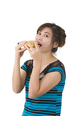 Image showing young woman eating a hamburger