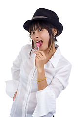 Image showing young woman with lollipop