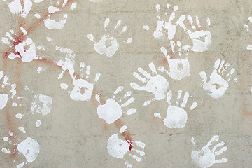 Image showing handprints on cement wall