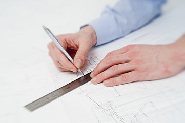 Image showing Engineer making adjustments in a drawing