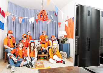 Image showing Watching the game at home