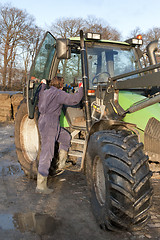 Image showing Boarding a tractor