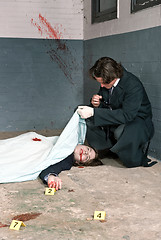 Image showing Examining a corpse