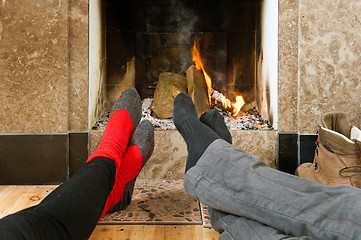 Image showing Warming by the fire