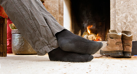 Image showing Feet by the fire