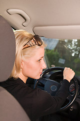 Image showing Young woman driving car