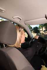 Image showing Young woman driving car