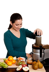 Image showing Woman making fruit juice