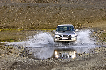 Image showing Crossing a river