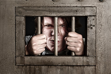 Image showing CP of a man behind bars