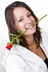 Image showing Woman biting rose