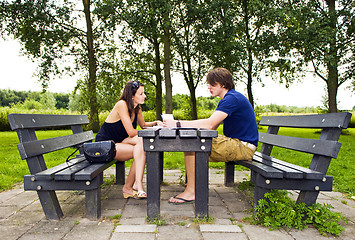 Image showing Couple at picnic table