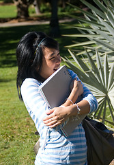 Image showing Student holding notes