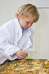 Image showing Decorating sweet bread