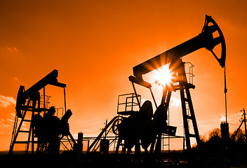 Image showing two oil pumps silhouette