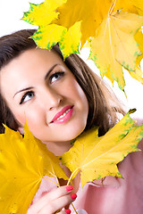 Image showing woman with yellow leaves 