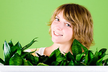 Image showing happy girl with plants 