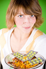 Image showing woman with heap of pills