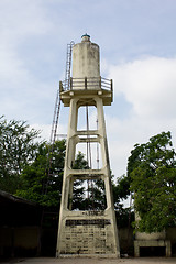 Image showing Old abandoned industrial water tower with reservoir tank in  fac