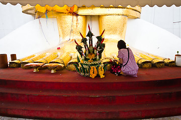 Image showing in front of big standing buddha foot 