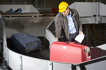 Image showing Luggage belt worker