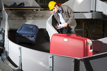 Image showing Checking luggage