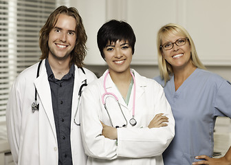 Image showing Three Smiling Male and Female Doctors or Nurses