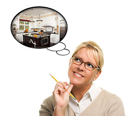 Image showing Woman with Thought Bubbles of a New Kitchen Design