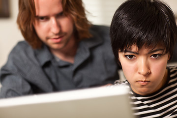 Image showing Young Man and Diligent Woman Using Laptop Together