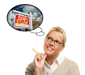 Image showing Woman with Thought Bubbles of a Sold Real Estate Sign