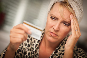 Image showing Upset Woman Holding Her Credit Card