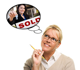 Image showing Woman with Thought Bubbles of Agent Handing Over New Keys