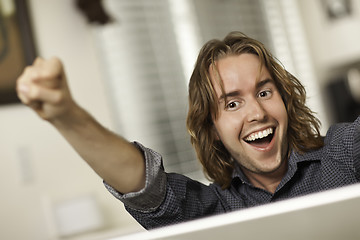 Image showing Happy Young Man Using Laptop Computer