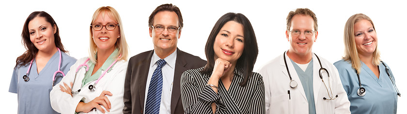 Image showing Hispanic Woman and Man with Doctors or Nurses Behind