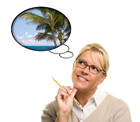 Image showing Beautiful Woman with Thought Bubbles of a Tropical Place