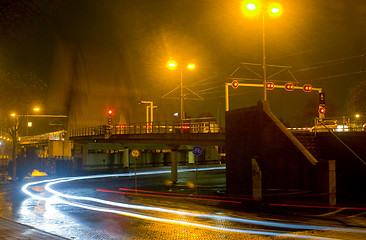 Image showing Waiting for a closing bridge during a heavy shower at night