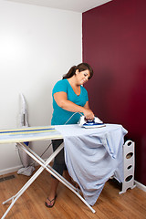 Image showing Woman Ironing Clothes