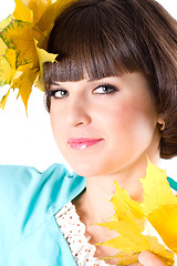 Image showing beautiful young woman with yellow leaves