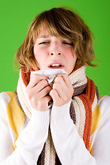 Image showing girl sneezes