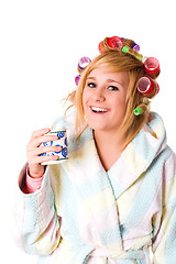 Image showing housewife with curlers and cup