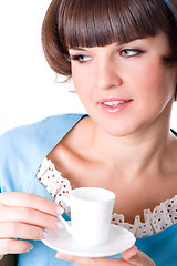 Image showing young woman enjoying a cup of coffee