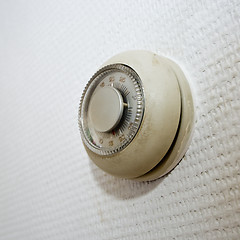 Image showing Old thermostat on a dirty wall