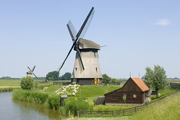 Image showing Double Dutch windmills