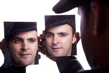 Image showing One man, with face on the mirror,