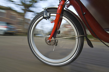 Image showing Spinning bicycle wheel