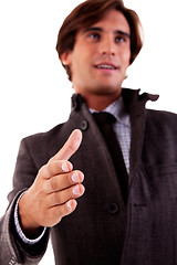 Image showing handsome business man, with the arm extended for a handshake