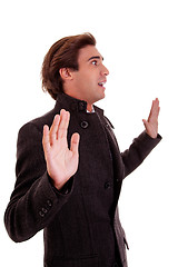 Image showing An admired businessman, with open arms as a signal to stop